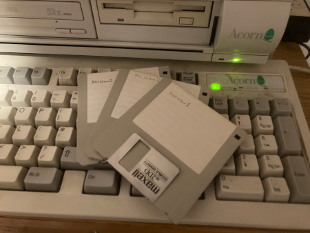 Floppy discs on a RiscPC keyboard.